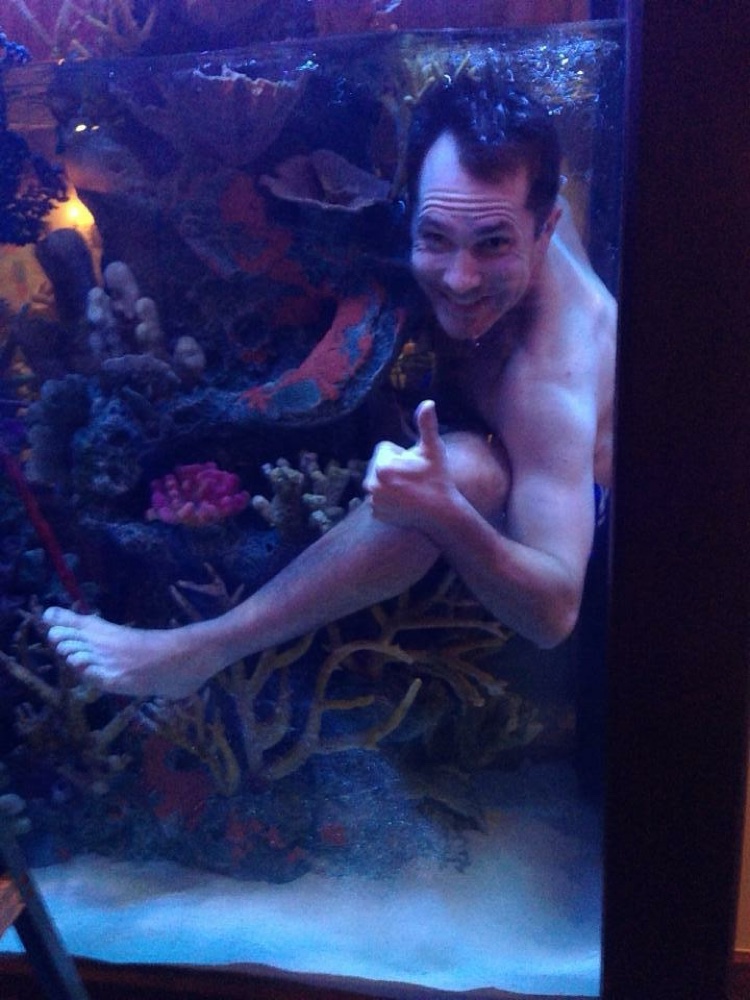 Ben Wehr at work inside a large aquarium